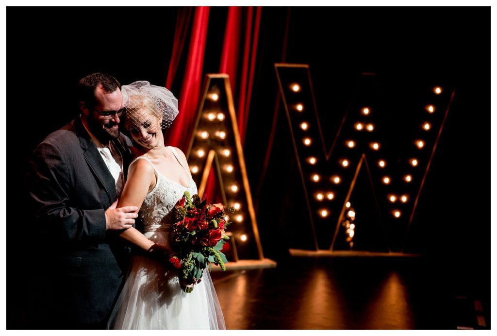 photo of a bride and groom in a theater