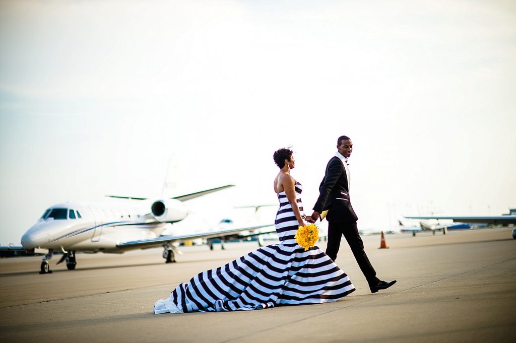 bride and groom at airport on runway