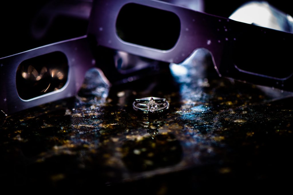 eclipse glasses and wedding rings