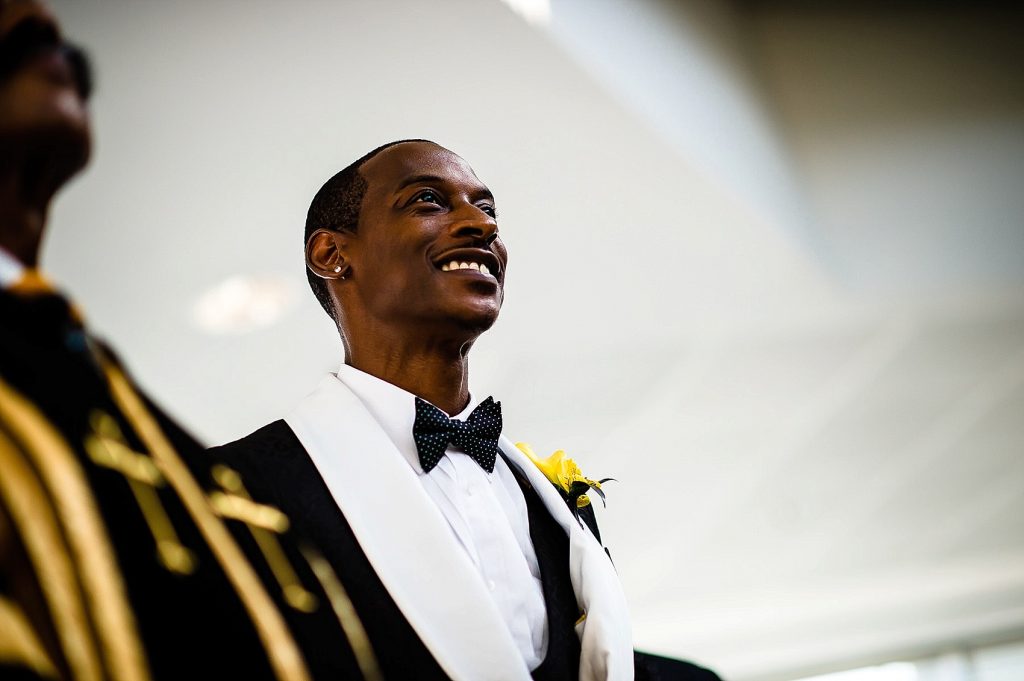 groom at altar waiting for bride