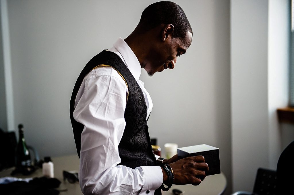 groom opening wedding gift