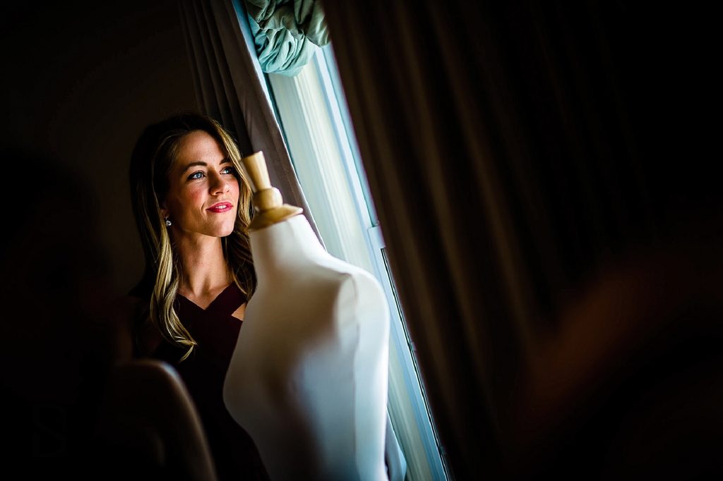 Bridesmaid by window