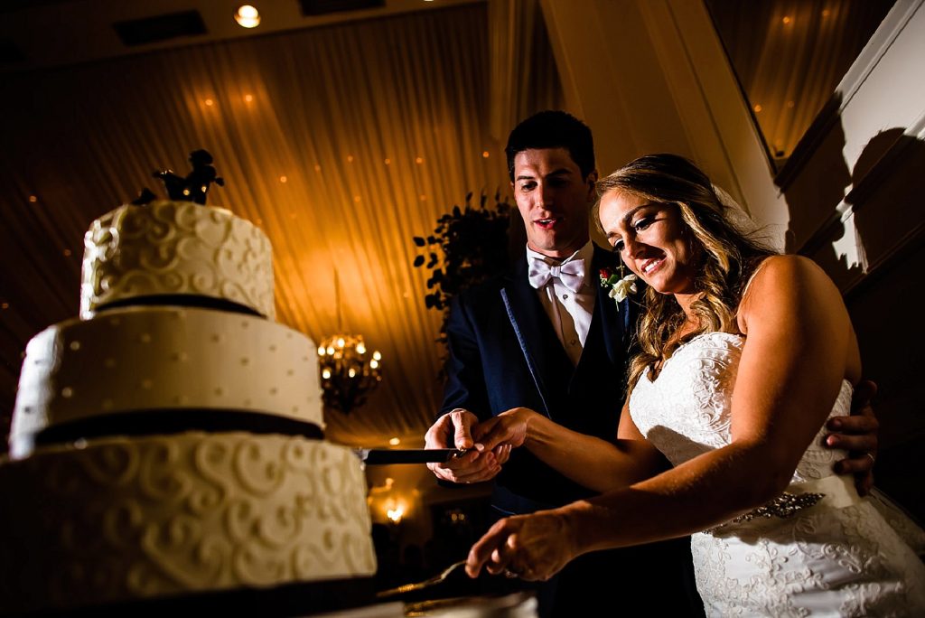 couple cutting wedding cake