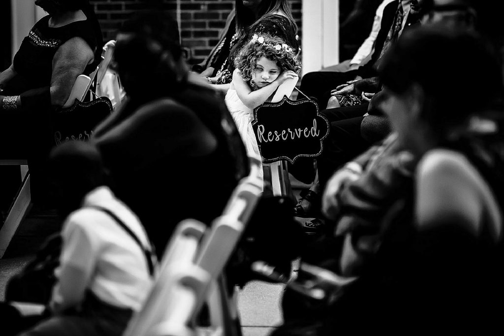 flower girl bored at the wedding