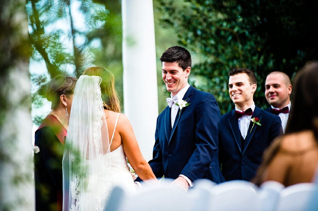 groom laughing during wedding