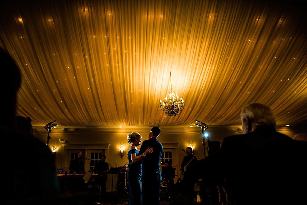 mother and son dancing at the highgrove estate ballroom