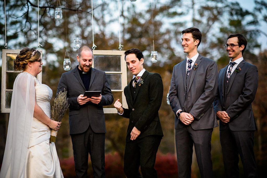 A candid wedding moment of the groom