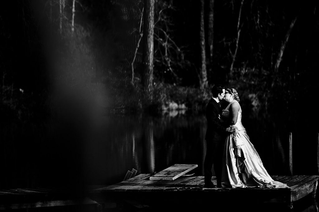 couple kissing on dock