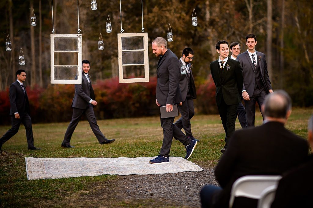 Groom and his groomsmen entering the wedding