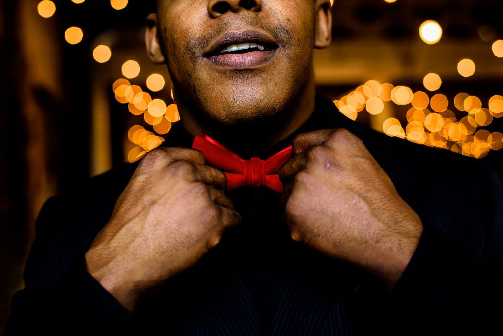 Groom getting ready at the stockroom