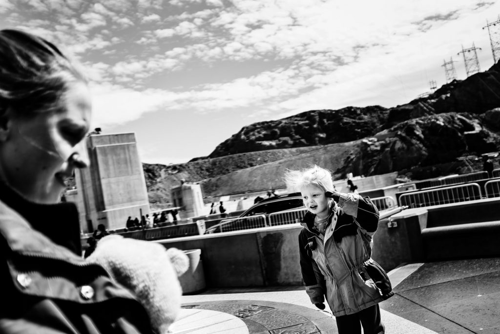 kid playing outside the hoover dam