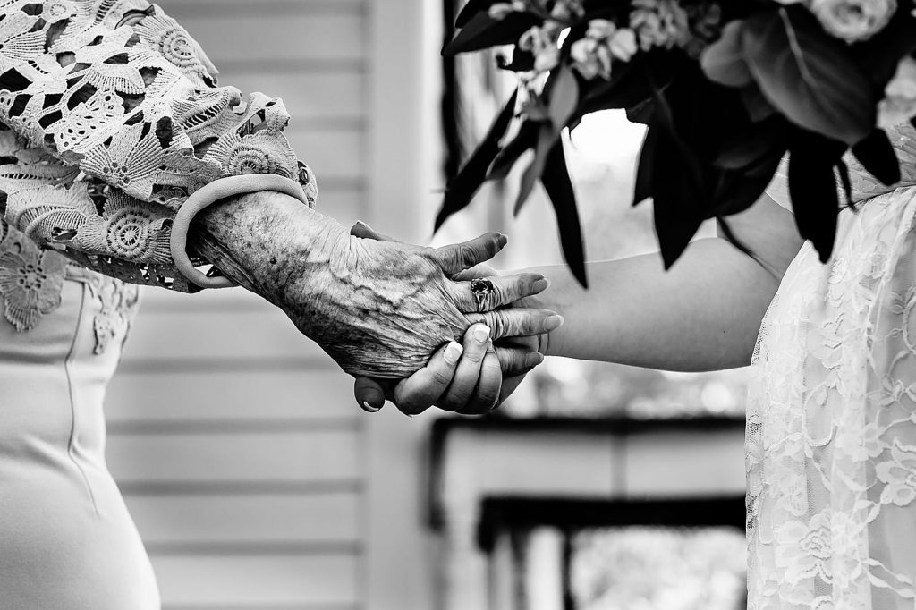 bride holding grandmas hand