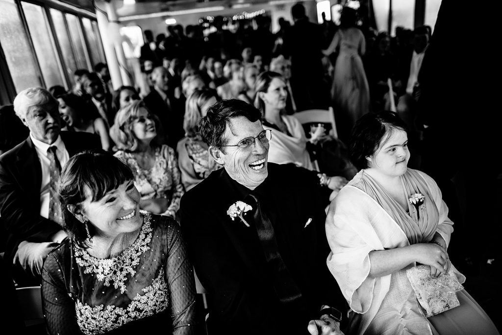 happy parents watching son get married
